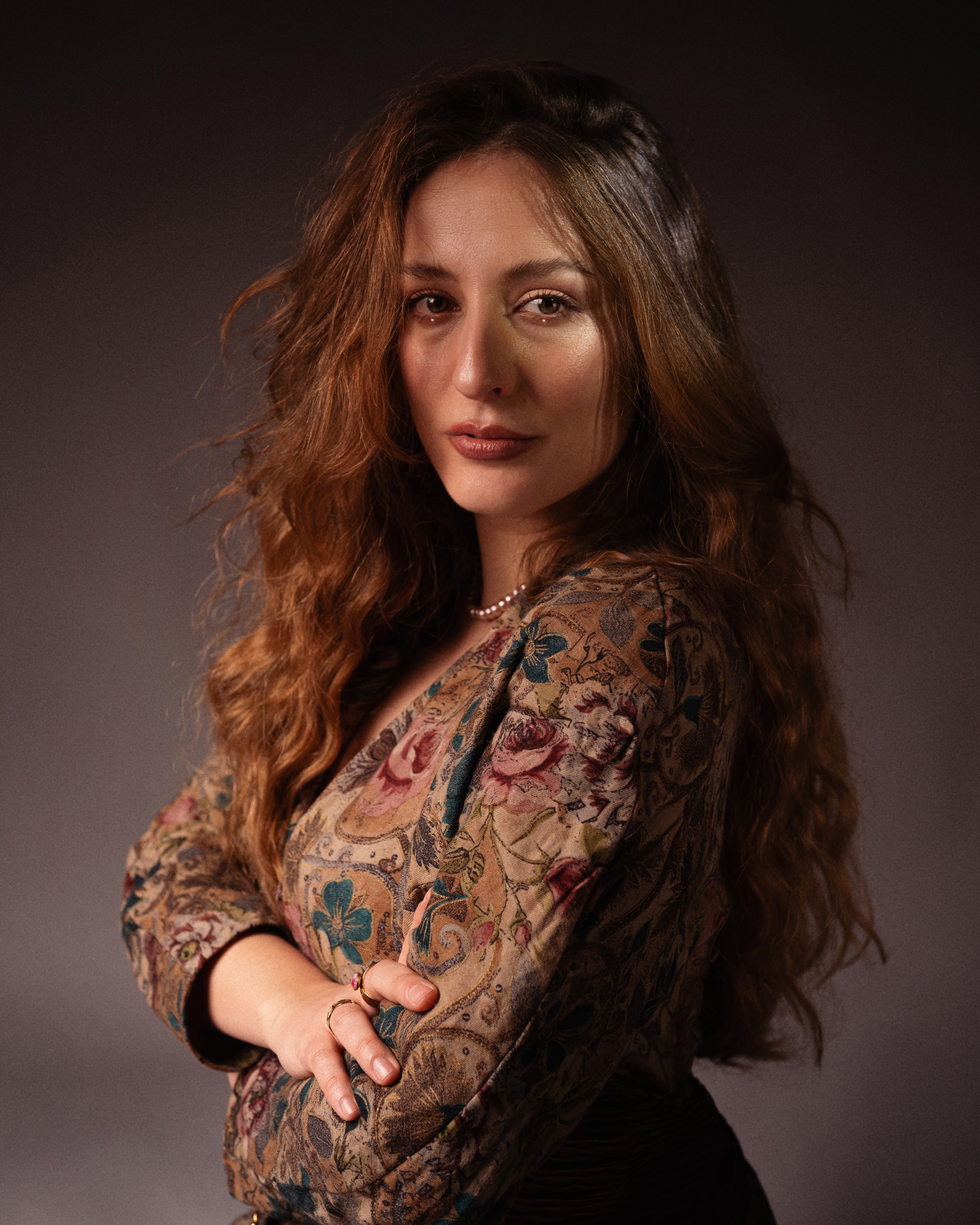 Portrait of photographer Kristel Pisani Massamormile holding a film camera